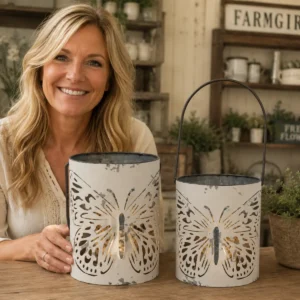 Set of distressed white butterfly buckets displayed on a rustic table in a farmhouse shop