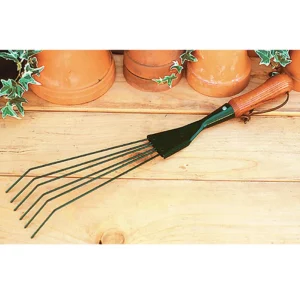 Kinsman narrow hand rake displayed on a wooden potting bench with terracotta pots