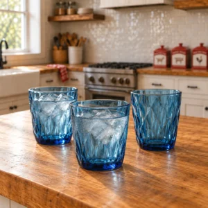 blue glass tumblers with ice water