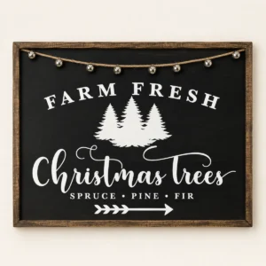 Framed black wood sign with white Farm Fresh Christmas Trees lettering, three evergreen trees, an arrow, and eight silver jingle bells.