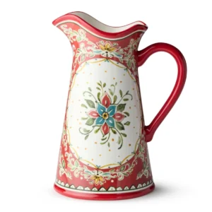 Angled view of the Provence ceramic pitcher showing its red handle and wavy rim